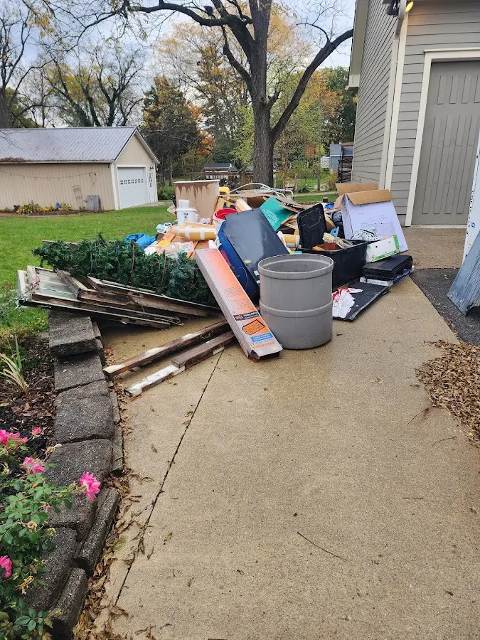 Dumpster being loaded with debris for 10 Yard Dumpster Rental in Lemoyne
